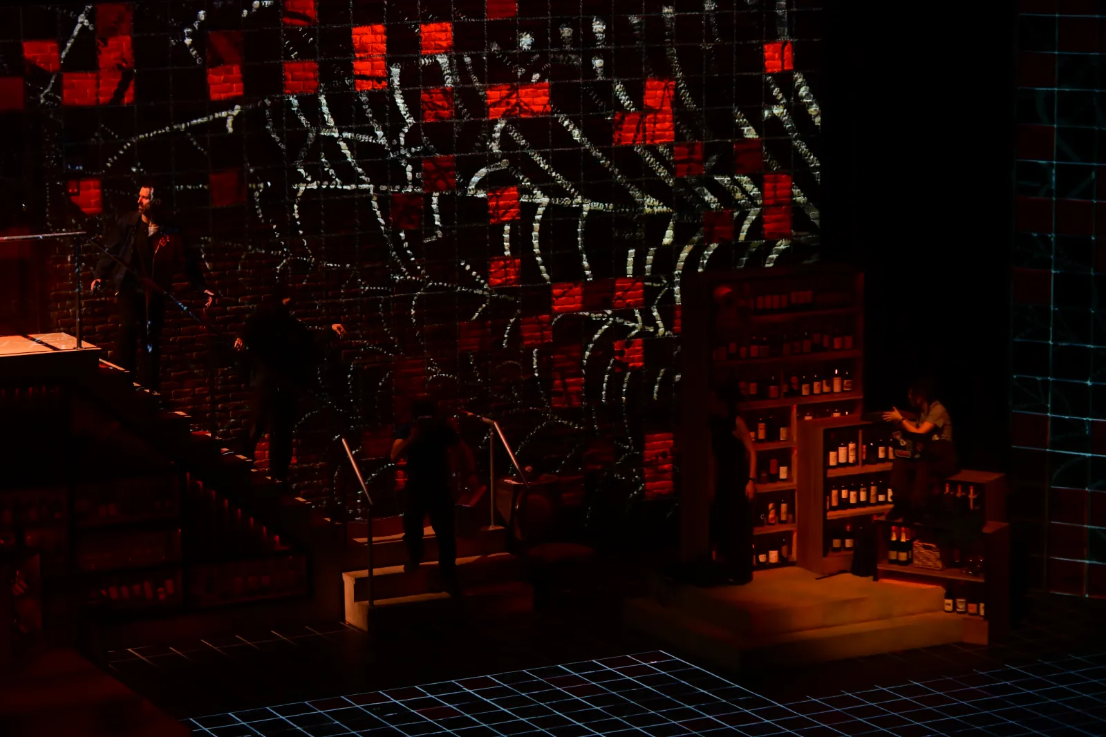 Heist: red and white shapes break across the brick wall and the stairs